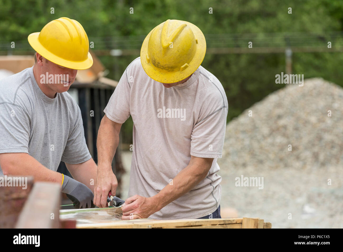 Engineers unpacking pallets for equipment installation Stock Photo