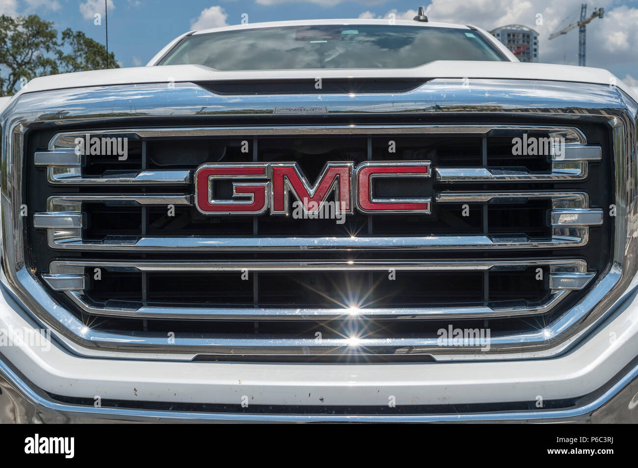 front chromed grille of a GMC truck with logo Stock Photo - Alamy