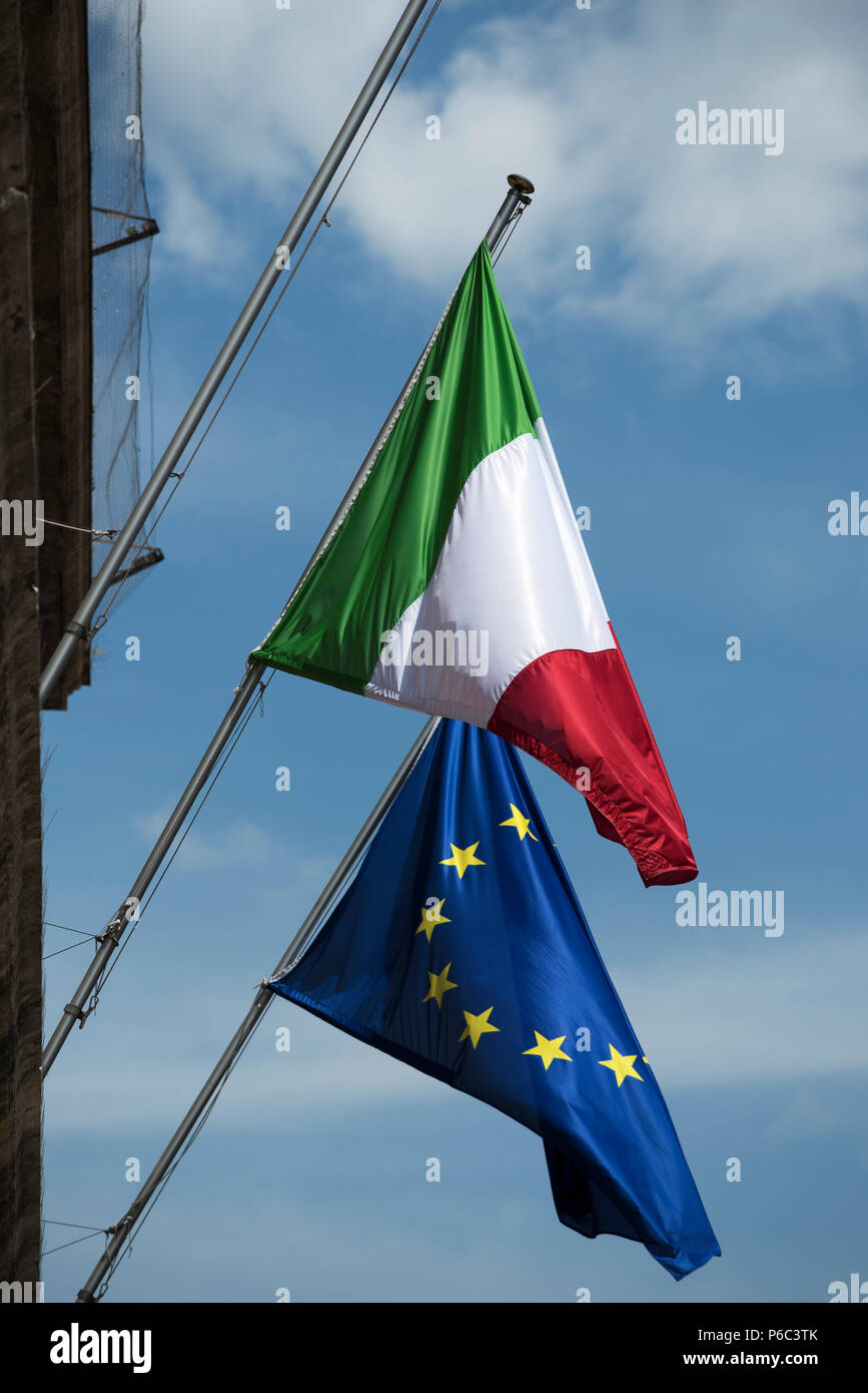 Italian and EU flags outside government offices in Verona. Verona is a city on the Adige river in Veneto, Italy, with approximately 257,000 inhabitant Stock Photo