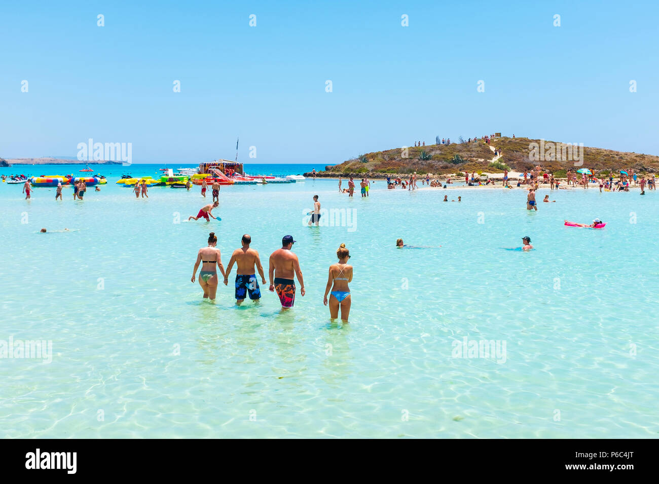 Tourists swimming in the sea at Nissi Bay, Nissi beach, near Ayiaa Napa,  Cyprus Stock Photo - Alamy