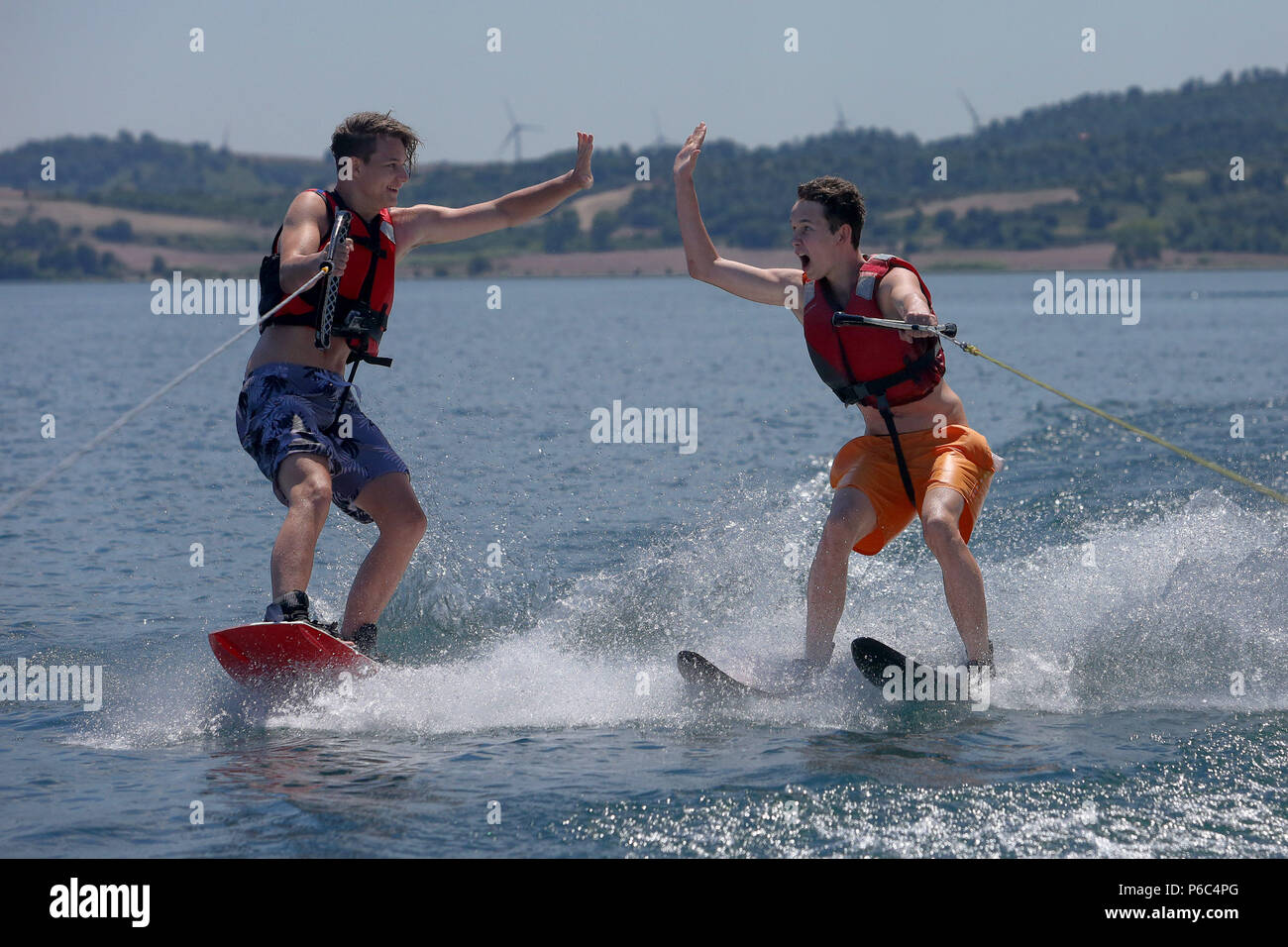 Capodimonte, Italy, boys go water skiing on Lake Bolsena Stock Photo