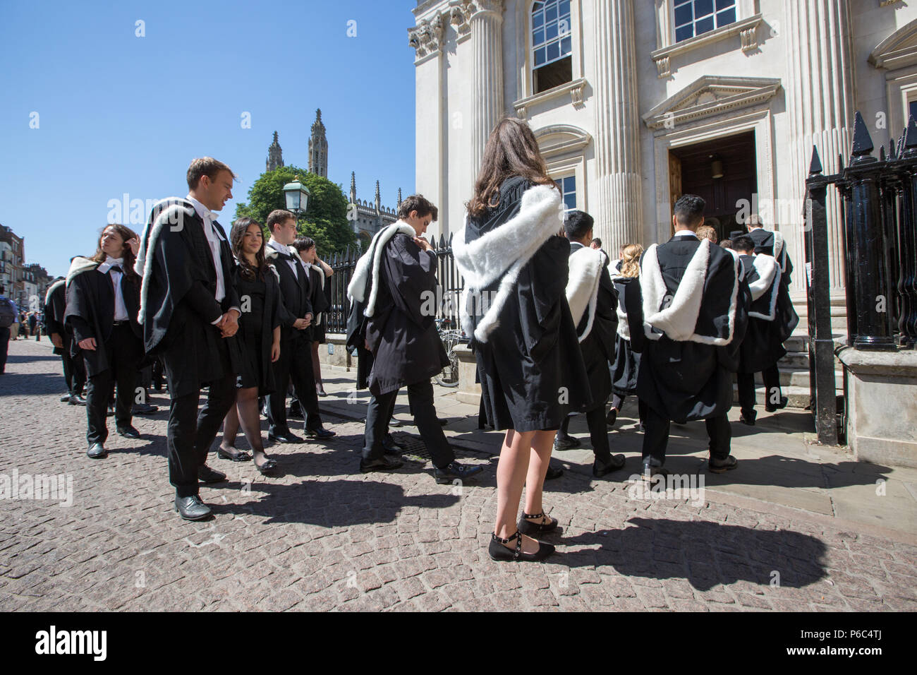 students from cambridge university on their way to the senate house