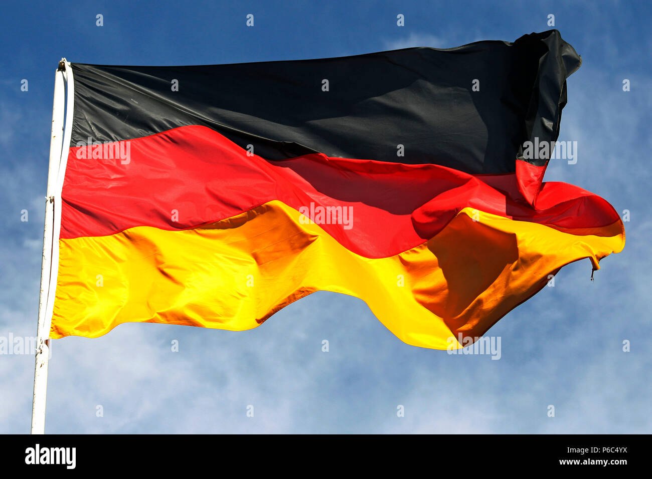 Hoppegarten, national flag of the Federal Republic of Germany blowing in the wind Stock Photo