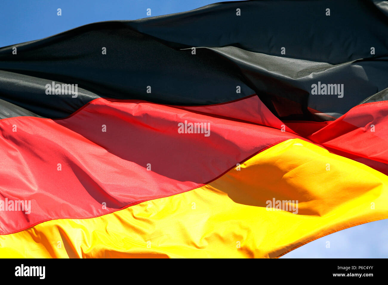 Hoppegarten, national flag of the Federal Republic of Germany blowing in the wind Stock Photo