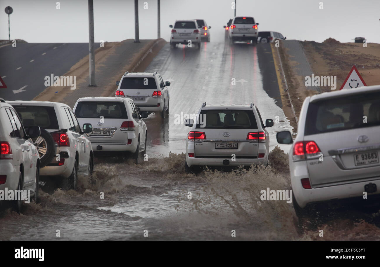 Dubai, United Arab Emirates, cars driving on a flooded street Stock Photo