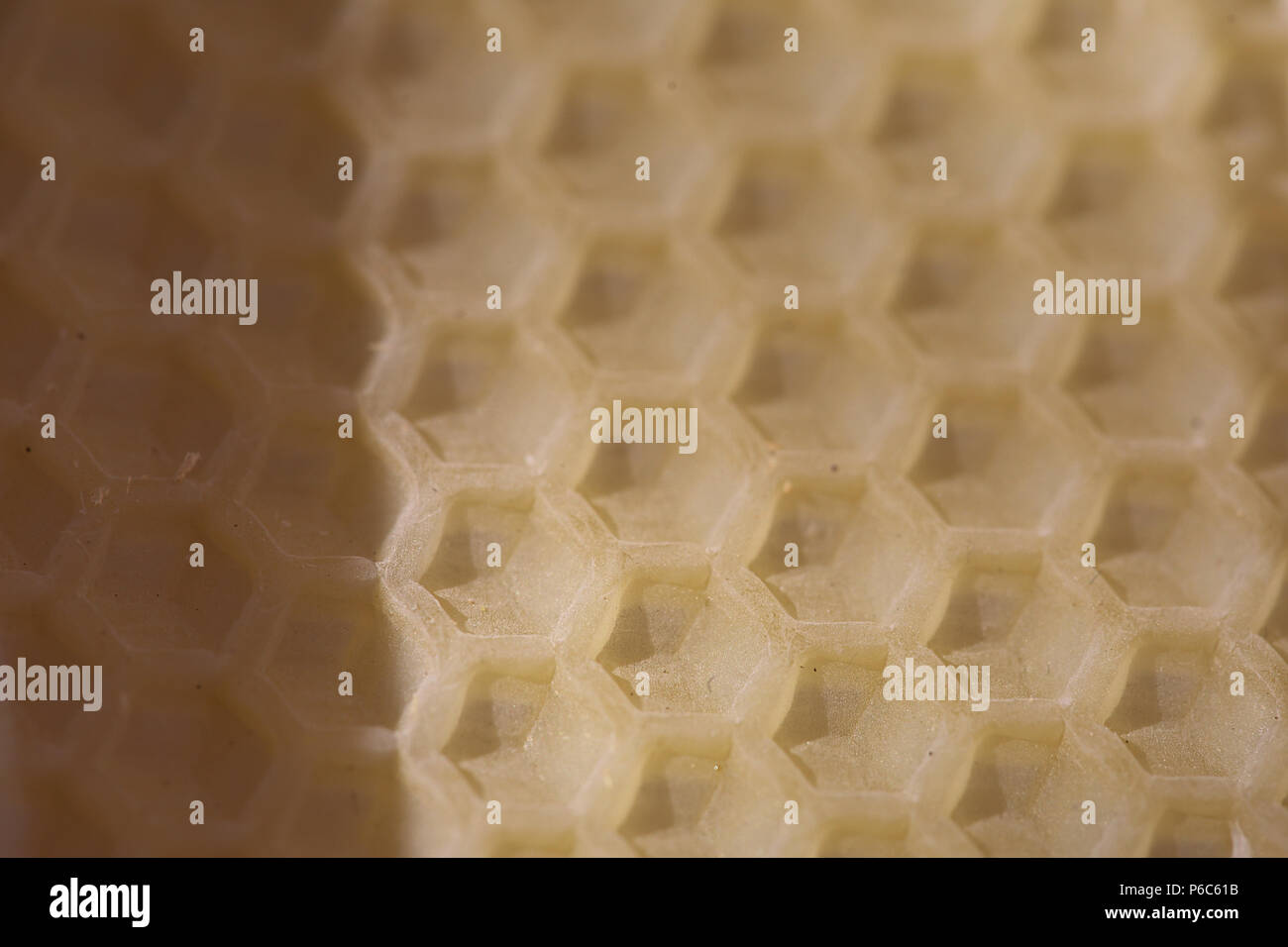 Berlin, Germany - Setting of the outline of honeycombs on a wax plate Stock Photo