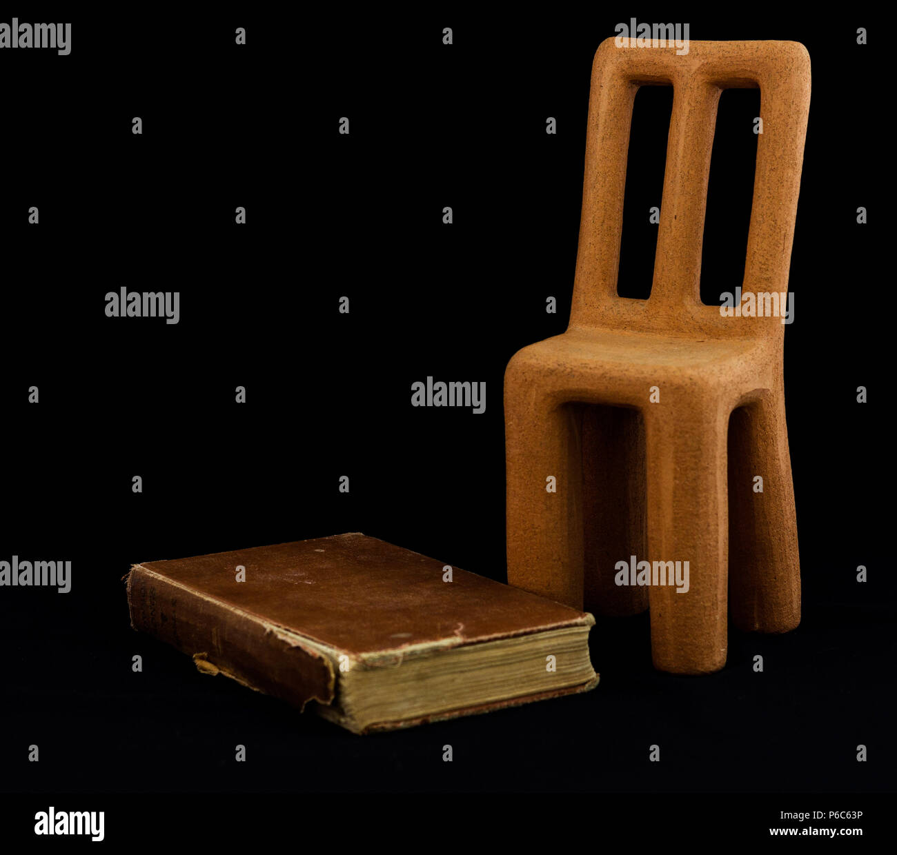 Clay chair, vintage book Stock Photo