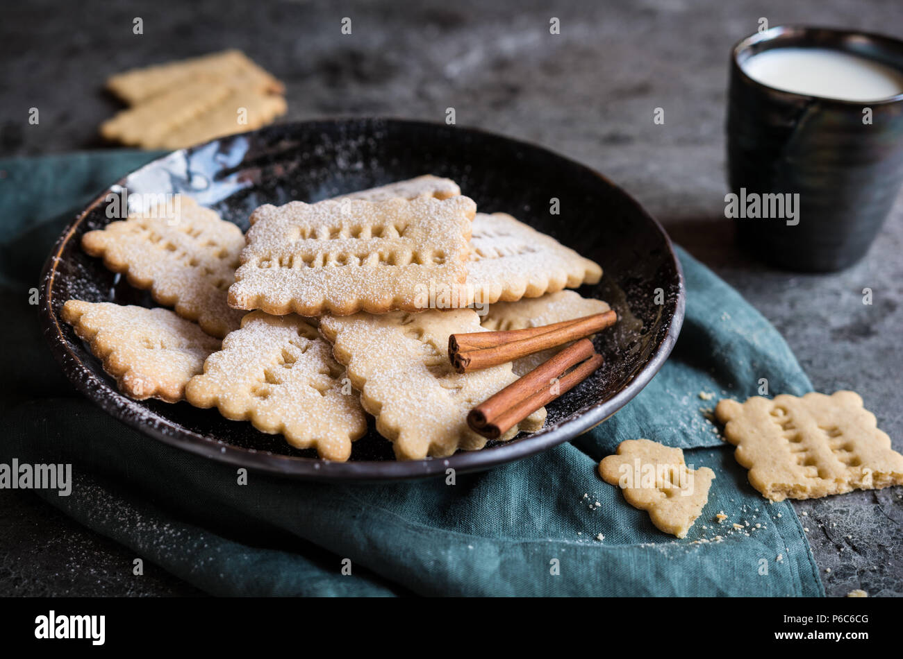 Homemade honey and cinnamon biscuits decorated with Christmas stamps