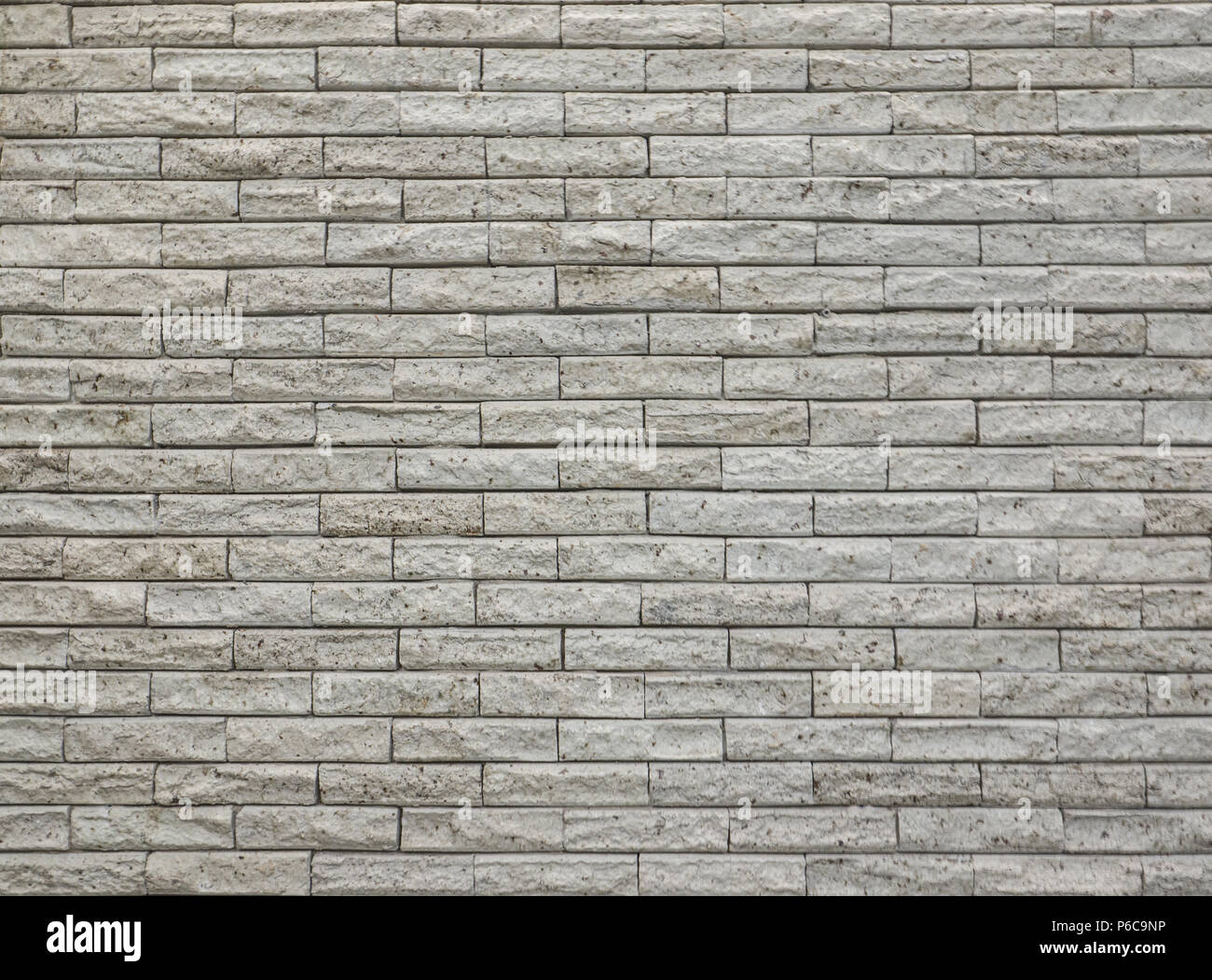 wall covered with clear porous tiles Stock Photo Alamy