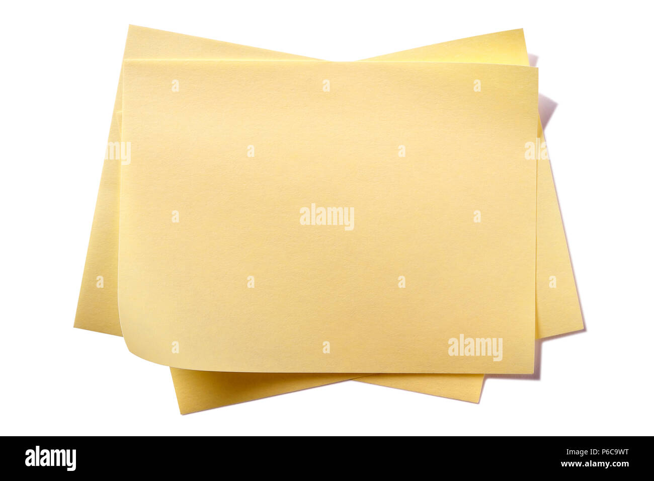 Untidy yellow sticky post notes isolated on white Stock Photo