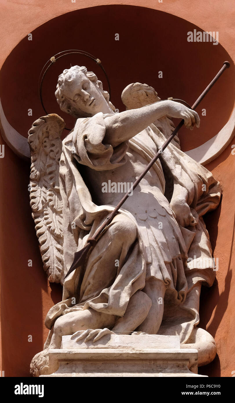 Saint Michael statue on the portal of St. Barbabas Church, Italy Stock ...