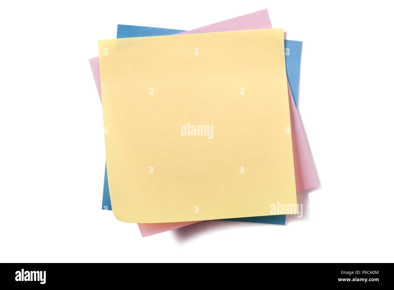 Untidy stack various different colors sticky post notes isolated on white Stock Photo