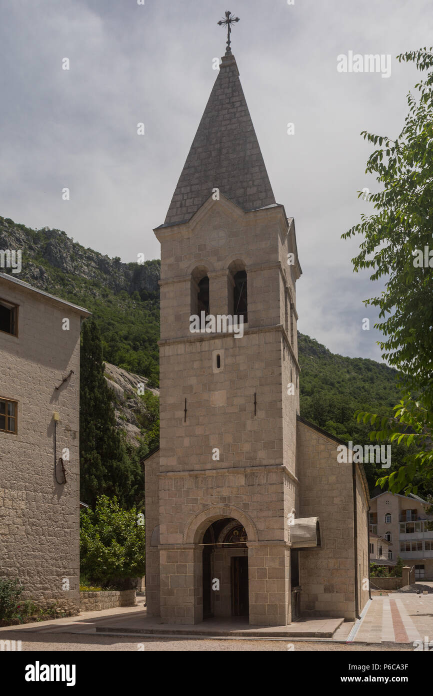 Front view of the Serbian Orthodox Church of The Holy Trinity at Ostrog Lower Monastery, Danilovgrad, Montenegro showing the bell tower and entrance. Stock Photo