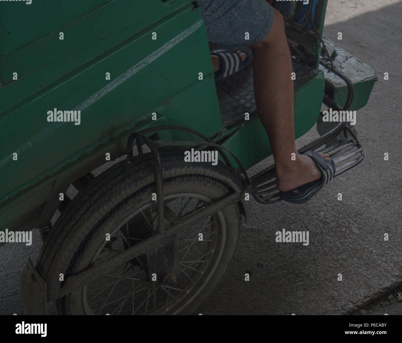 Riding the public tricycle in the Philippines. Stock Photo