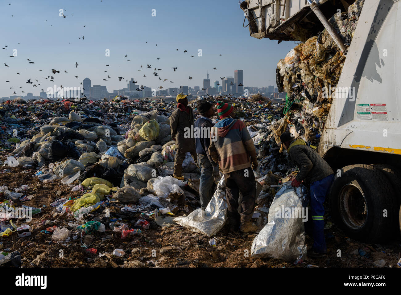 A South African municipal truck disgorges rubbish at the Robinson Deep landfill in the county's commercial capital of Johannesburg Stock Photo