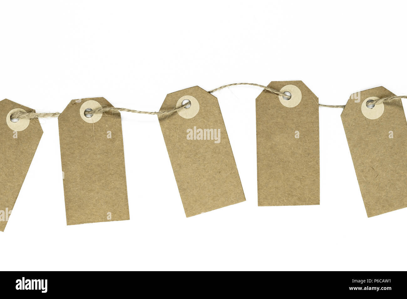 Blank brown note cards with copy space stuffed on brown rope like garland and isolated on white