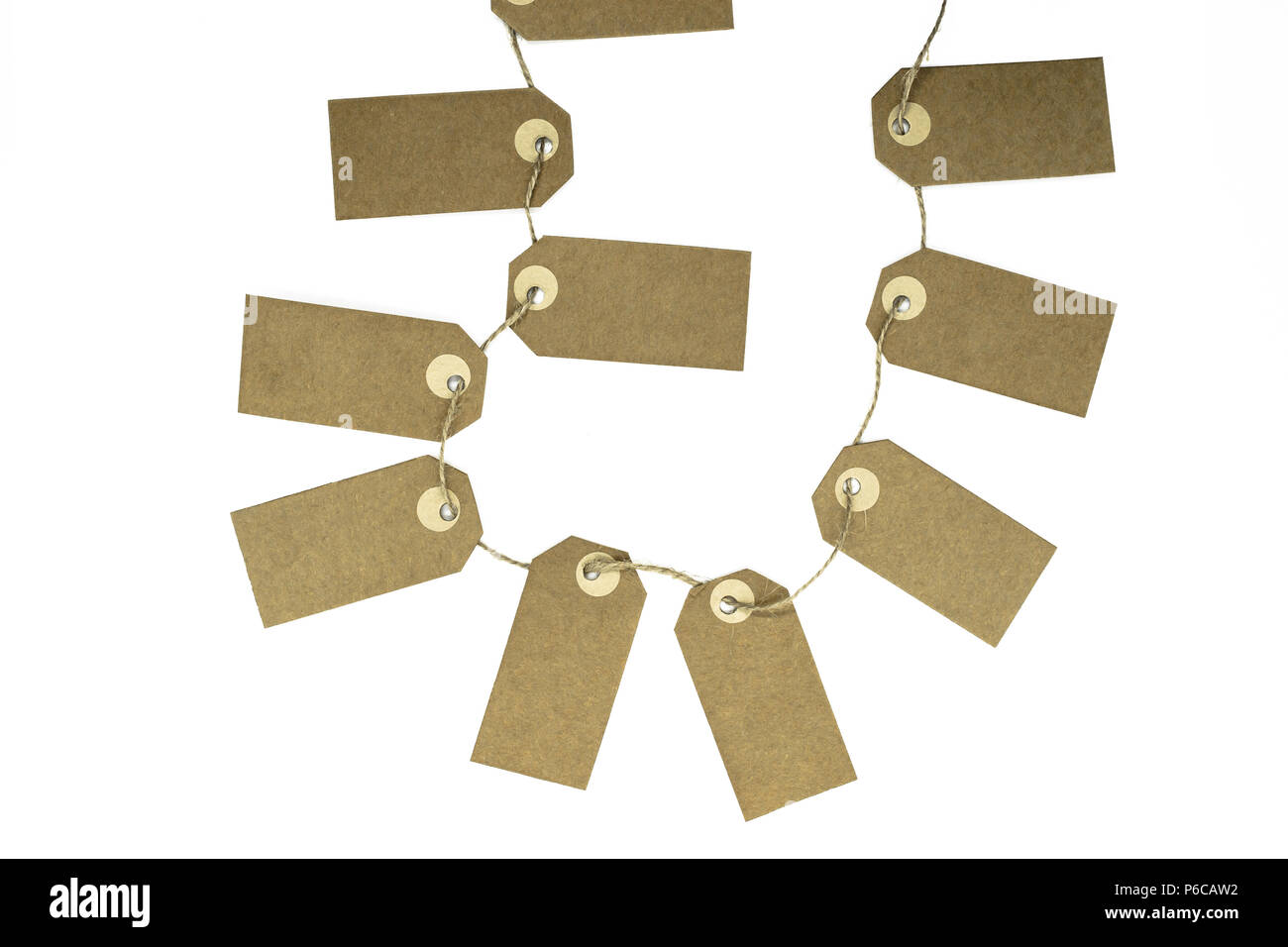 Blank brown note cards with copy space stuffed on brown rope like garland and isolated on white