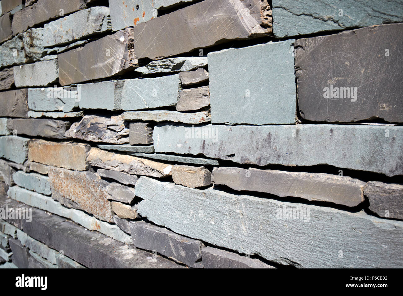 wall of building built of slate lakeland stone construction Ambleside lake district cumbria england uk Stock Photo