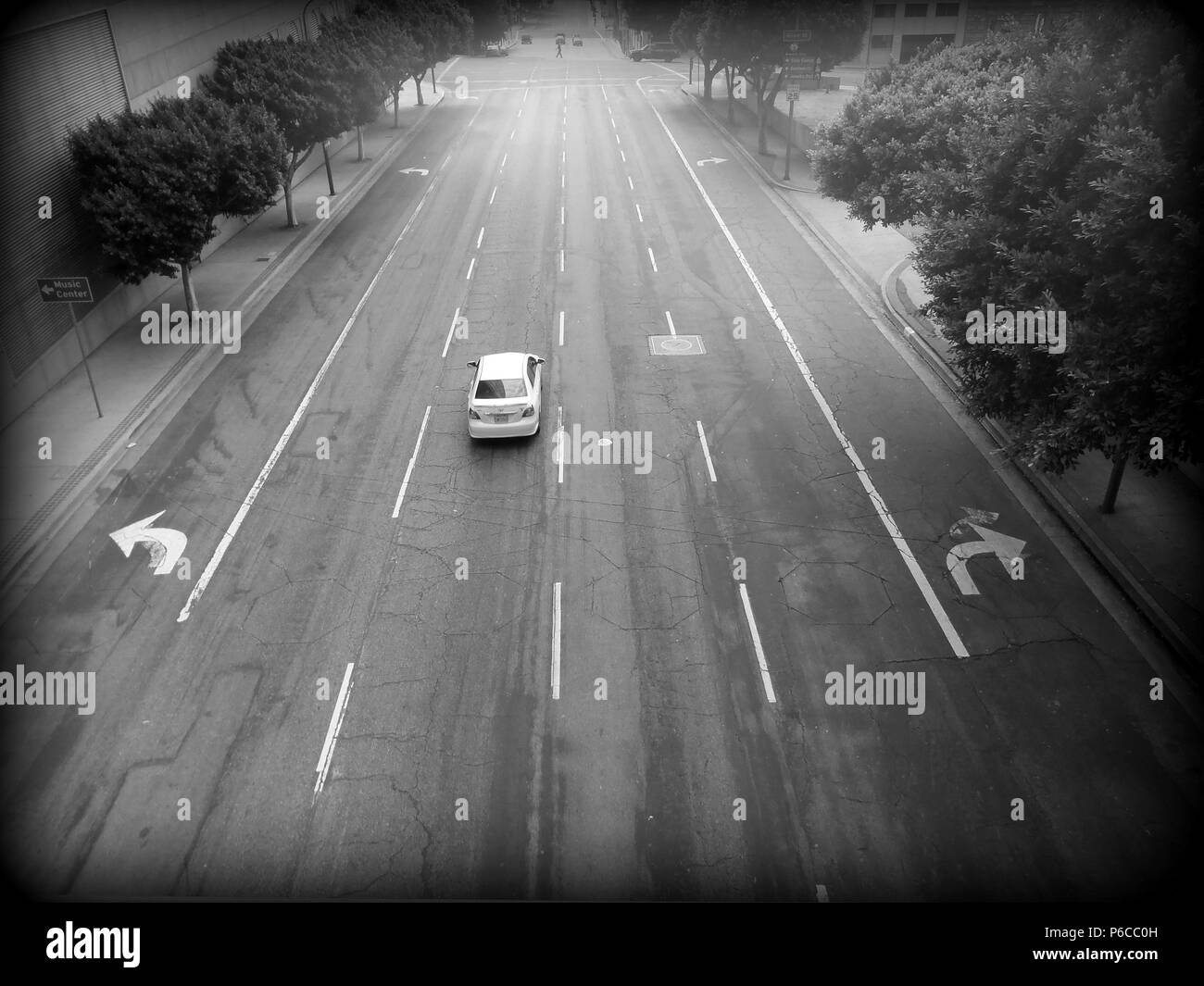 A quiet morning in Los Angeles; one car cruises a multi-laned road Stock Photo