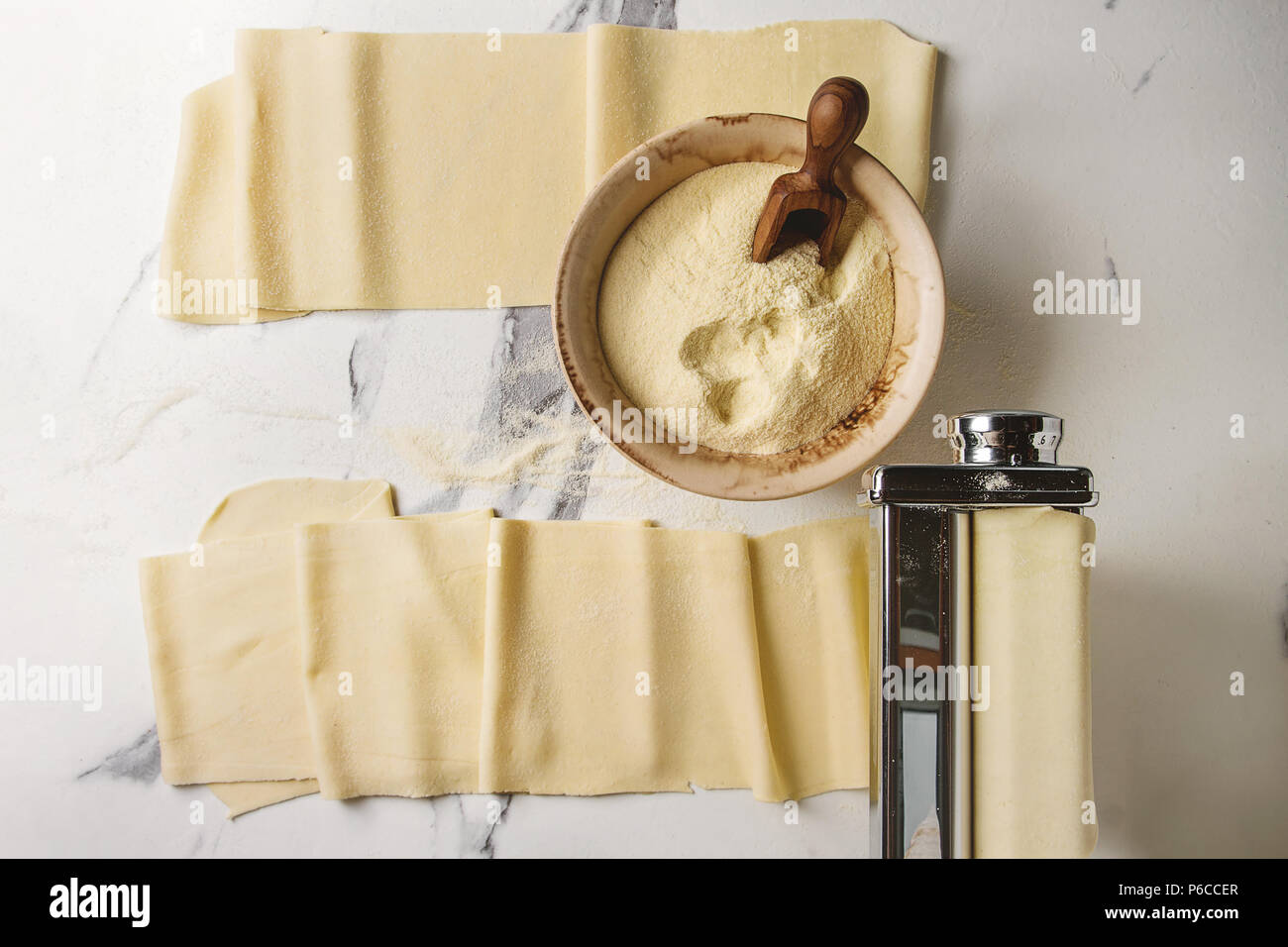 Rolled dough for homemade italian uncooked pasta lasagna from pasta machine maker with semolina