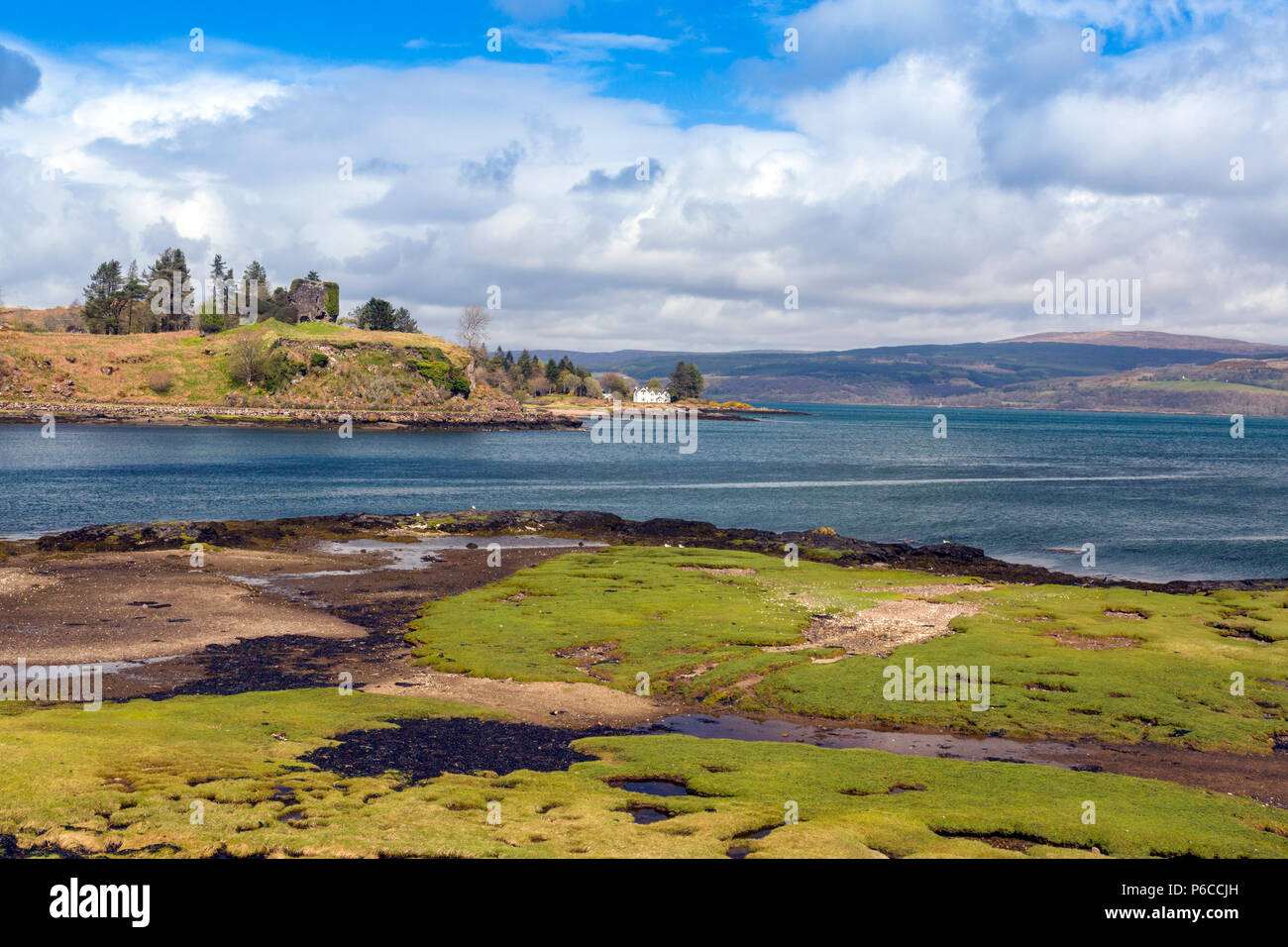The ruins of Aros Castle and the White House at Aros both overlook the Sound of Mull, Isle of Mull, Argyll and Bute, Scotland, UK Stock Photo