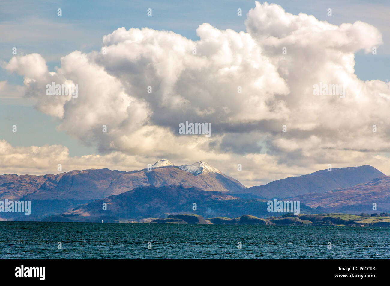 Snow on the summits of Sgorr Dhearg and Sgorr Dhonuill viewed across Loch Linnhe from an Oban - Mull ferry, Argyll and Bute, Scotland, UK Stock Photo