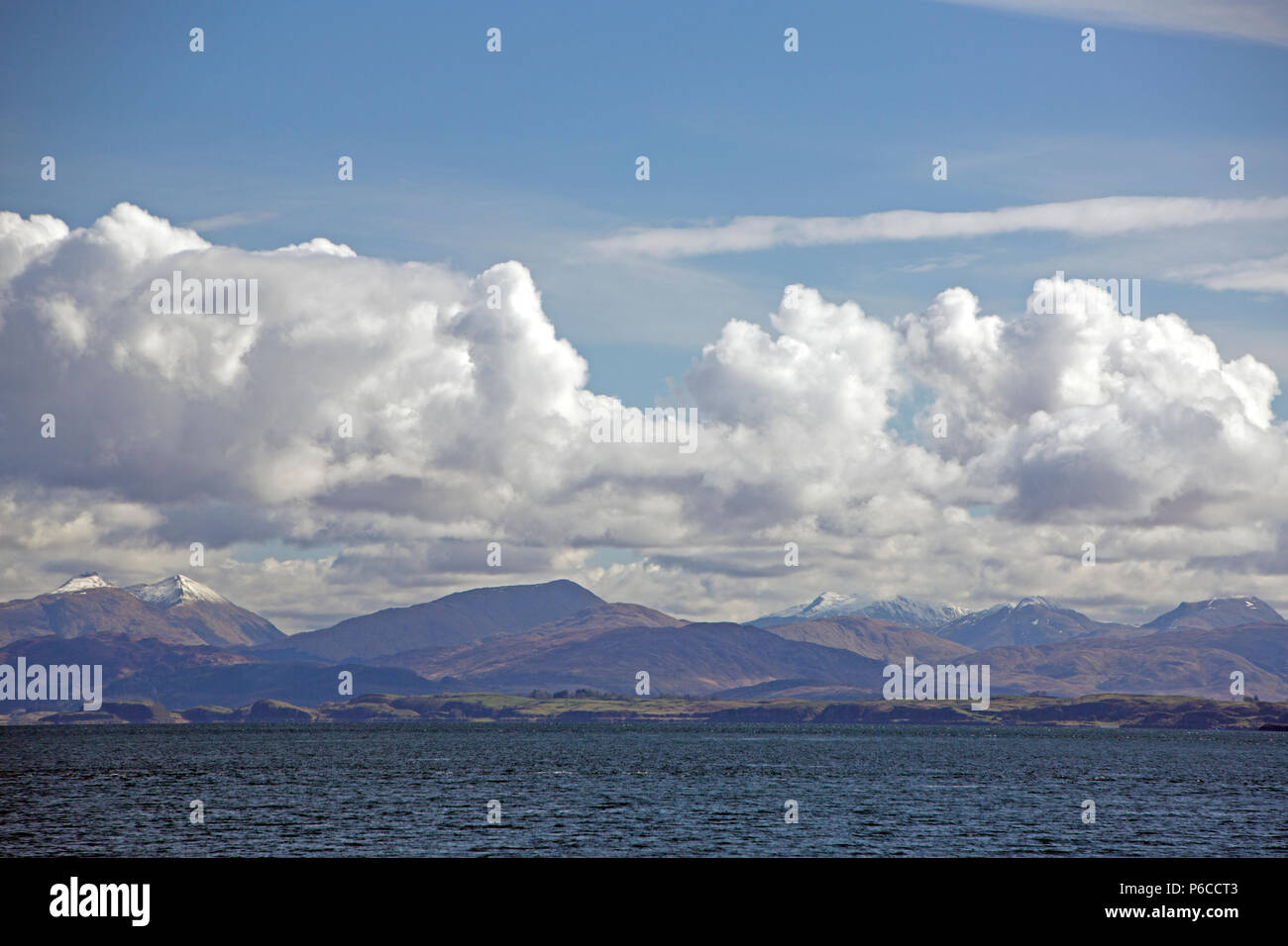 Snow on the summits of Sgorr Dhearg and Sgorr Dhonuill viewed across Loch Linnhe from an Oban - Mull ferry, Argyll and Bute, Scotland, UK Stock Photo