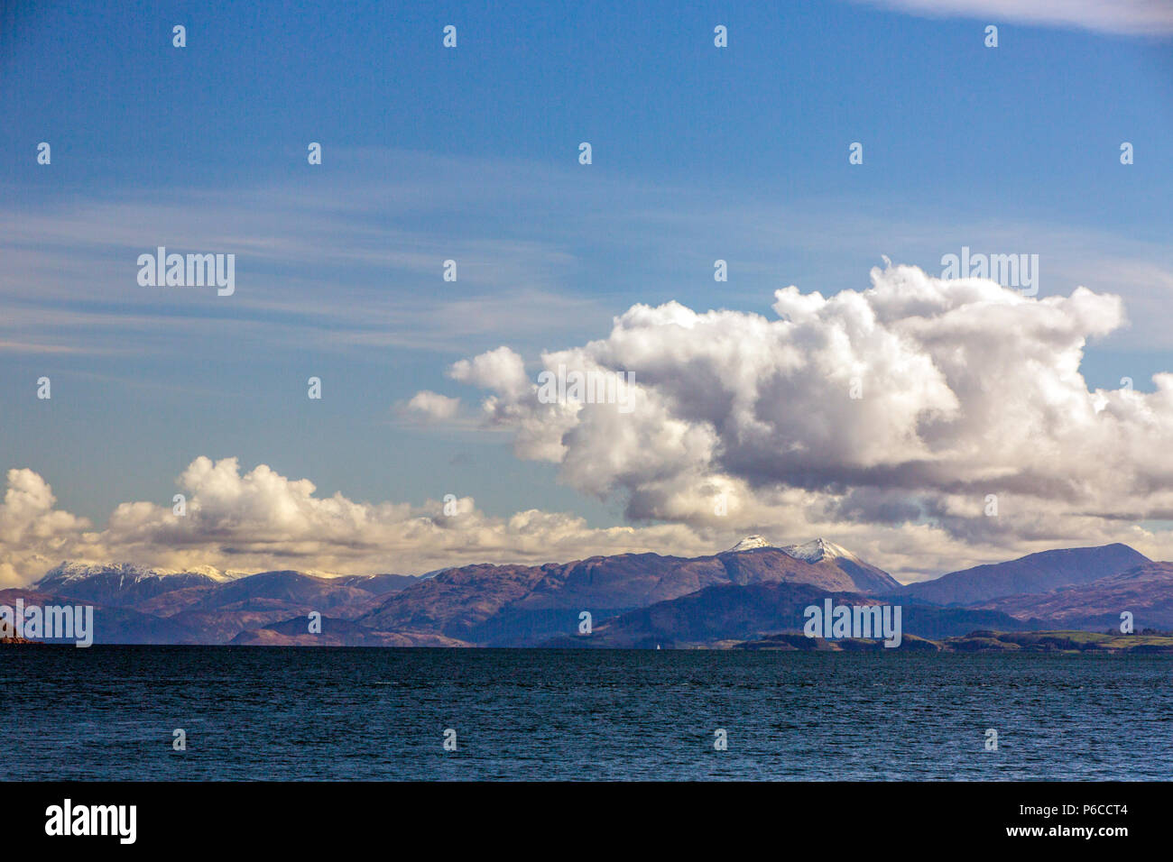 Snow on the summits of Sgorr Dhearg and Sgorr Dhonuill viewed across Loch Linnhe from an Oban - Mull ferry, Argyll and Bute, Scotland, UK Stock Photo