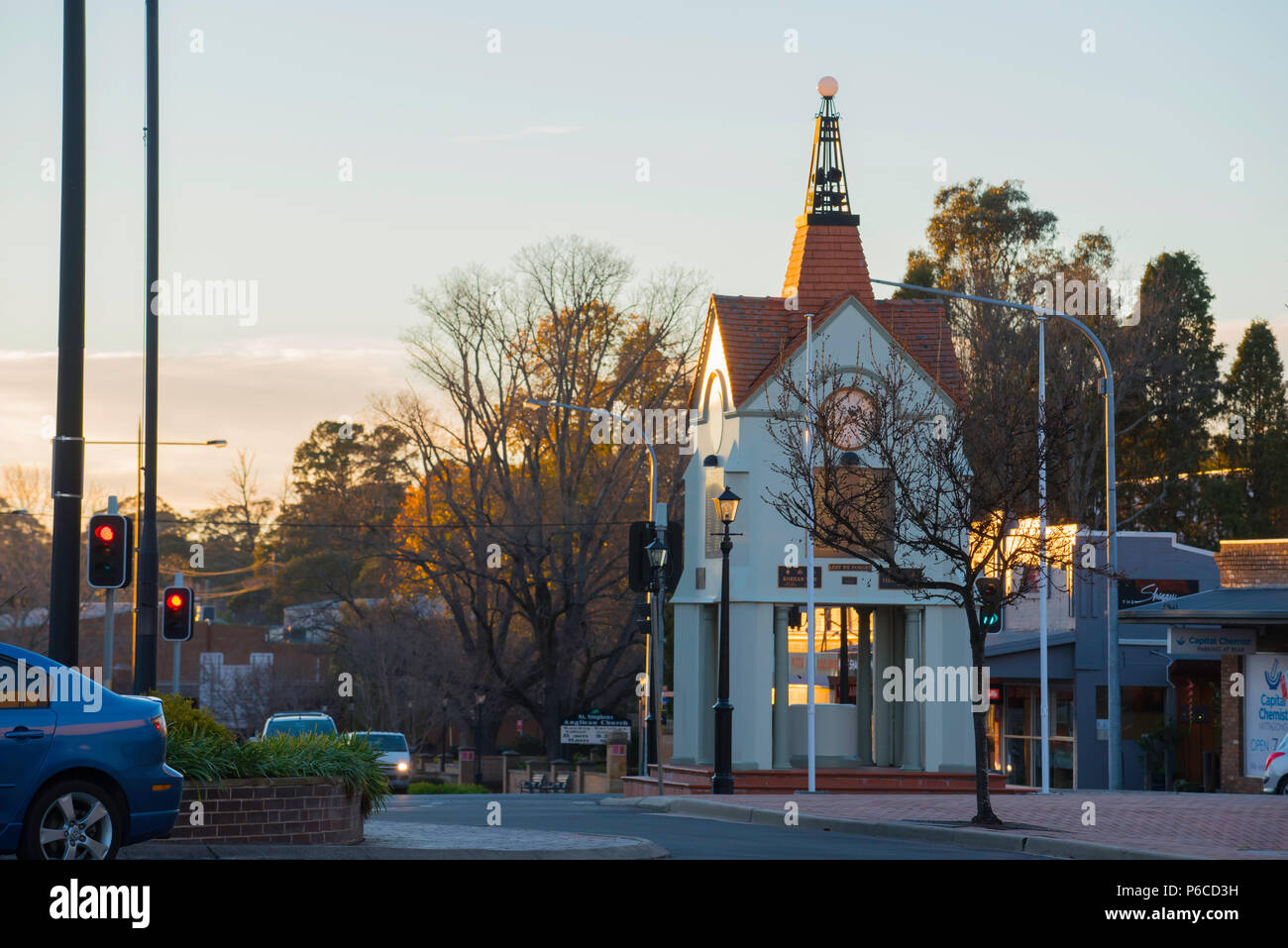 Early morning winter sun hits the town clock and war memorial on the corner of Main Street and Bowral Road in Mittagong, New South Wales, Australia Stock Photo