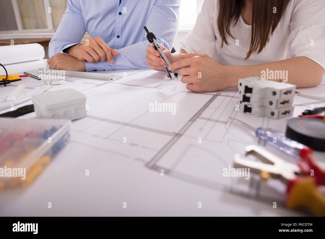 Two Architect Working With Work Tools Over Blueprint Stock Photo