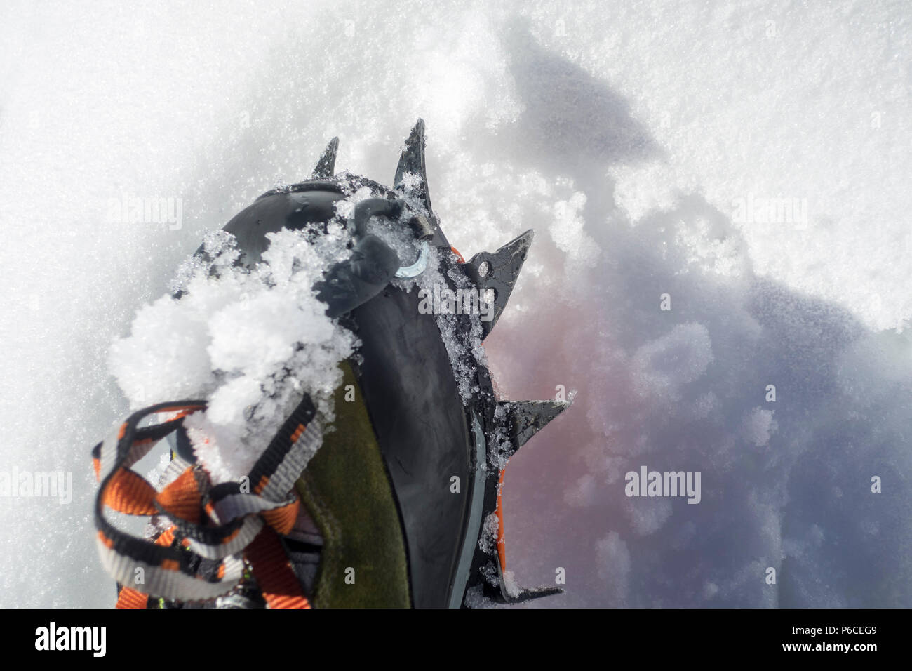 Crampons closeup. Crampons closeup. Crampon on winter boot for