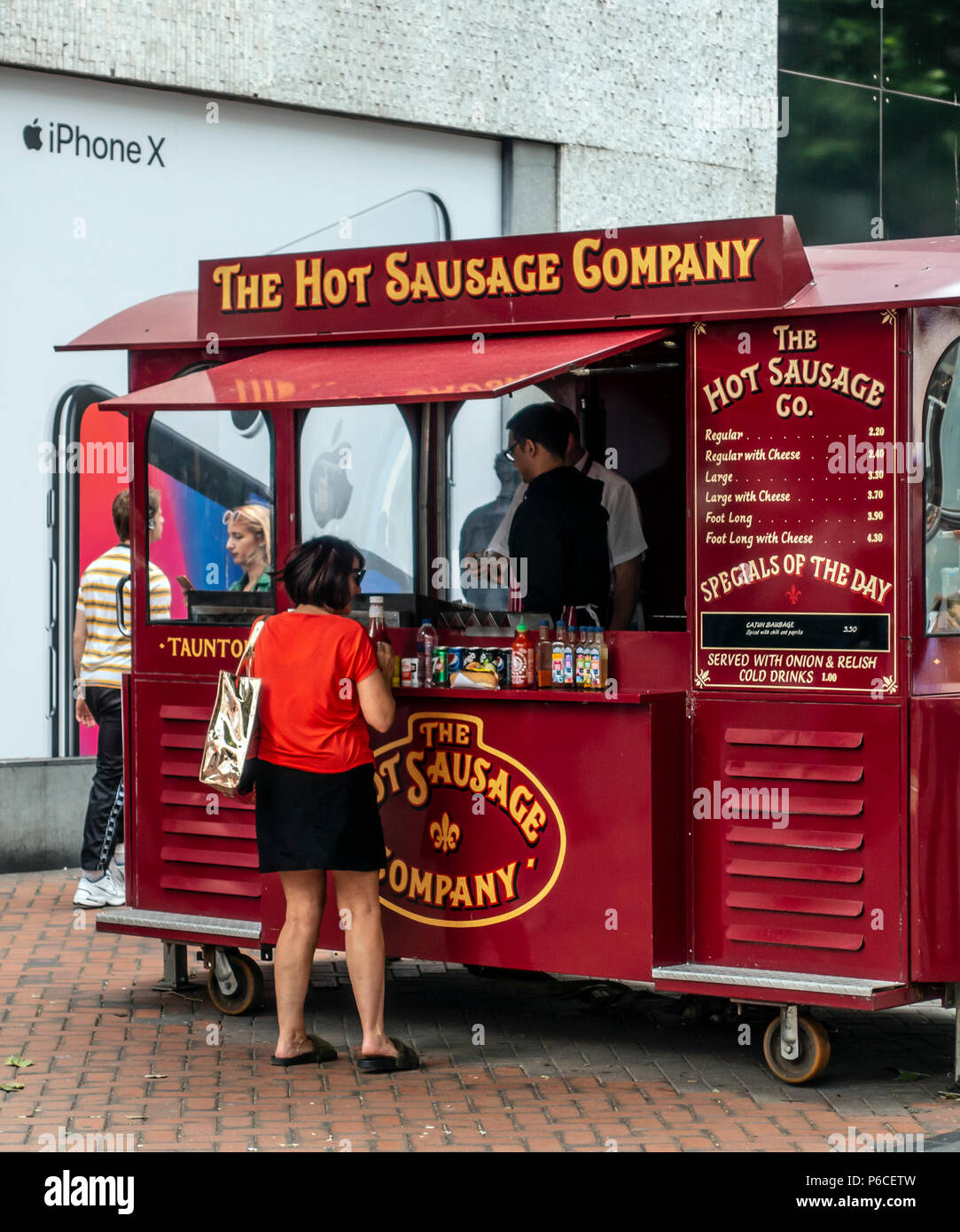 Customer at The Hot Sausage Company fast food stall (tramcar) in  photo