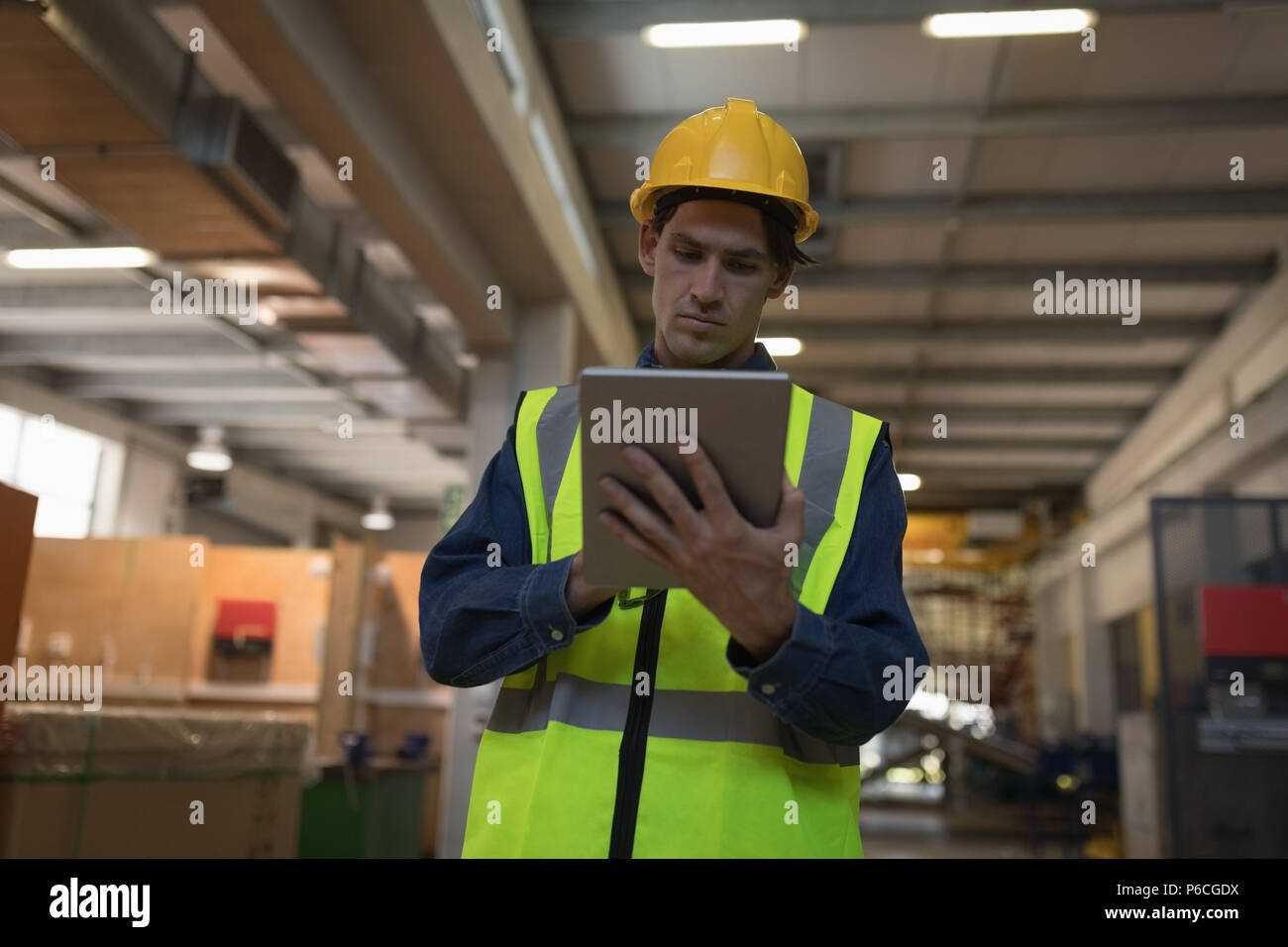 Male worker using digital tablet at solar station Stock Photo