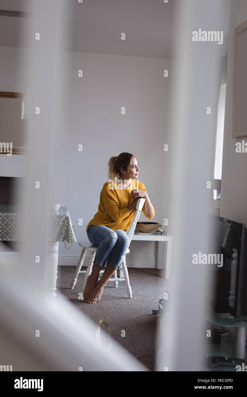 Woman sitting on chair hi-res stock photography and images - Alamy