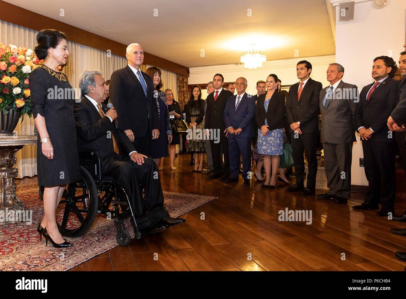 U.S. Vice President Mike Pence, center, listens as Ecuador President Lenin Moreno, left, and First Lady Rocío Gonzalez de Moreno speak during a reception at the government palace June 28, 2018 in Quito, Ecuador. Stock Photo