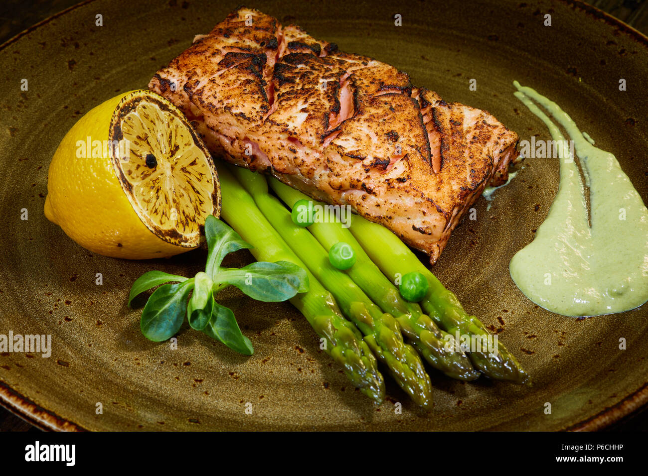 Slow Cooked Salmon fillet steak with salad on plate, Sous-Vide Cooking  Salmon Fish Stock Photo - Alamy