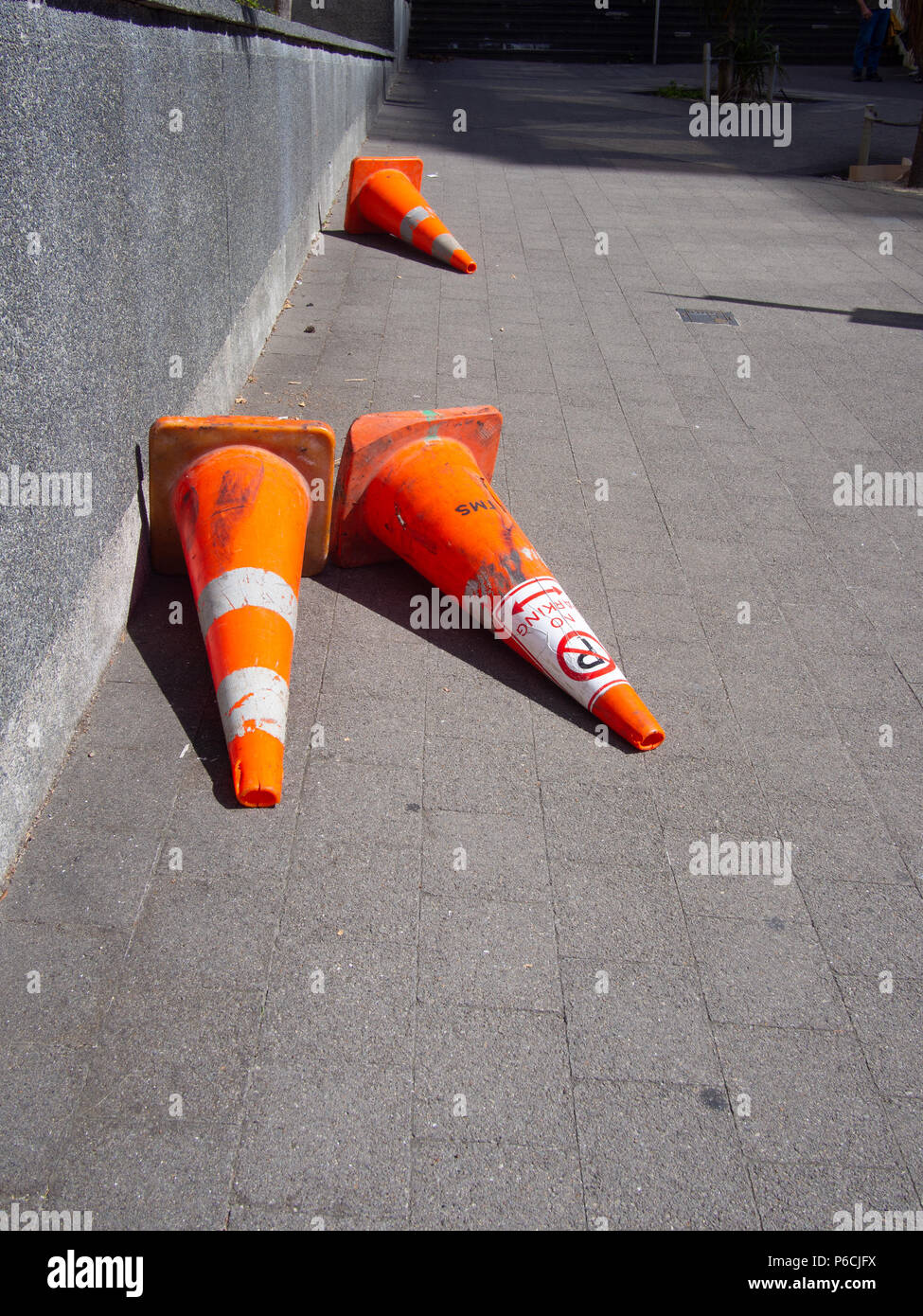 Traffic Cones Fallen Over On The Footpath Stock Photo