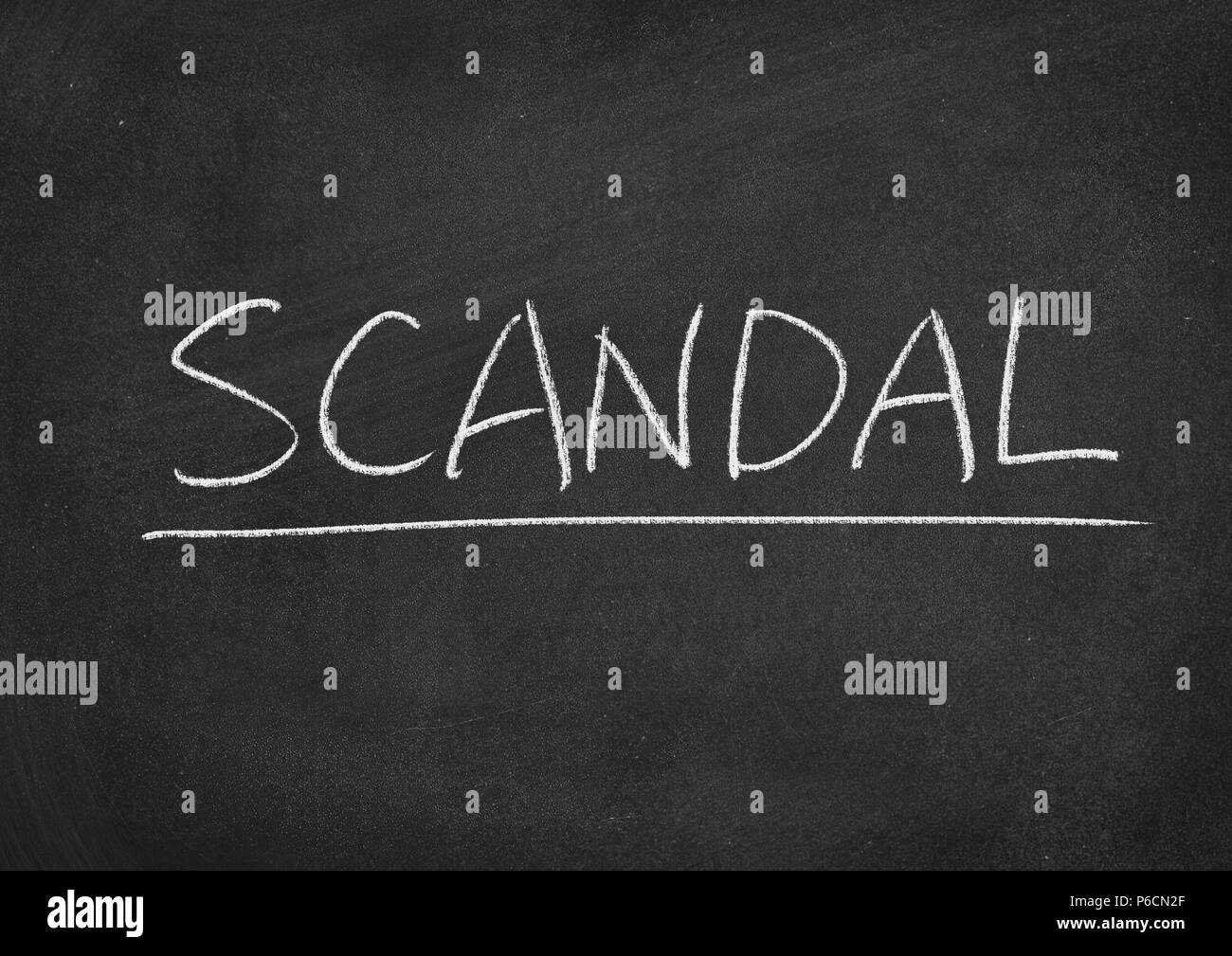 scandal concept word on a blackboard background Stock Photo