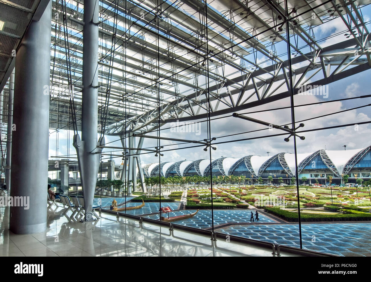 A travel hub of Asia, glass, stainless steel stretched fabric make the architectural superstructure of Bangkok's Suvarnabhumi International Airport. Stock Photo