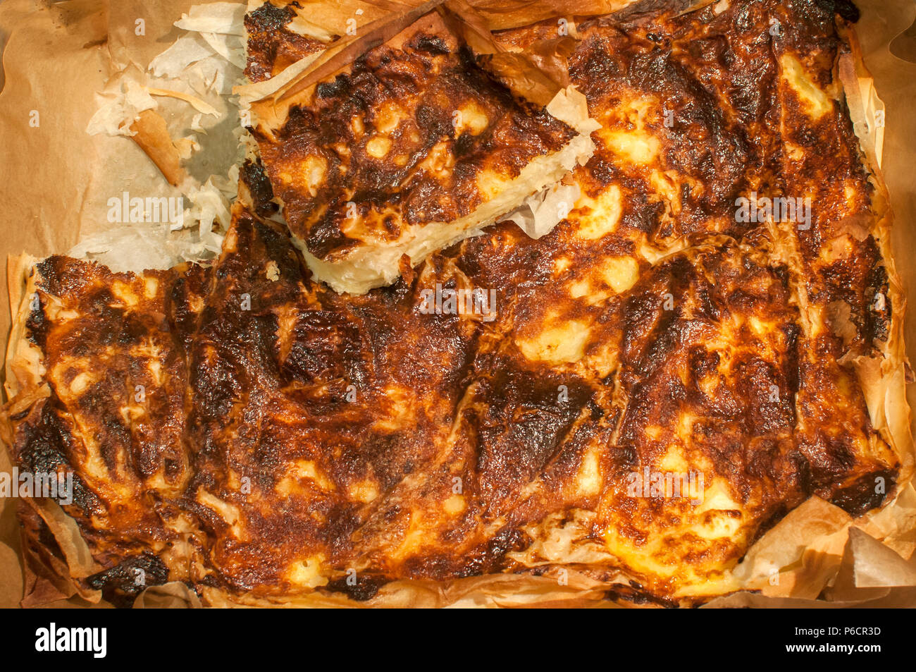 Homemade pie with filo pastry whisked eggs and white cheese closeup Stock Photo