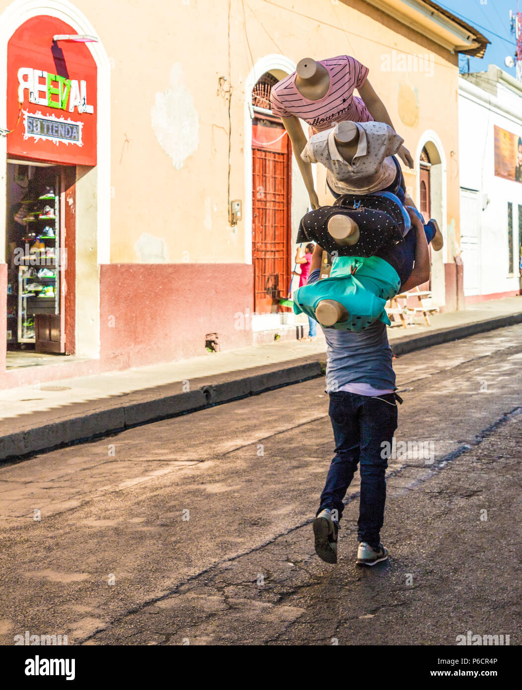 Leon, Nicaragua. February 2018. A view of someone walking with many mannequins in Leon Nicaragua Stock Photo