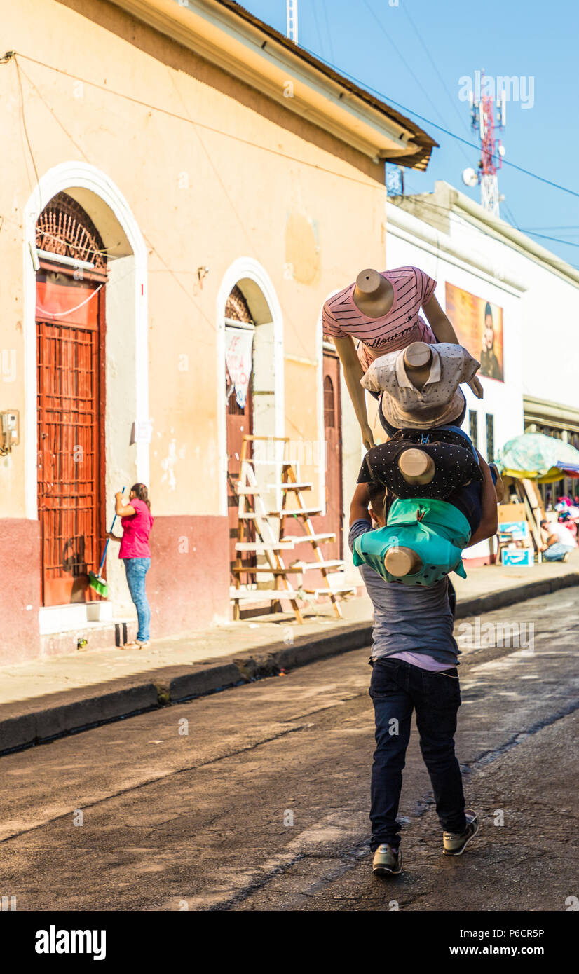 Leon, Nicaragua. February 2018. A view of someone walking with many mannequins in Leon Nicaragua Stock Photo
