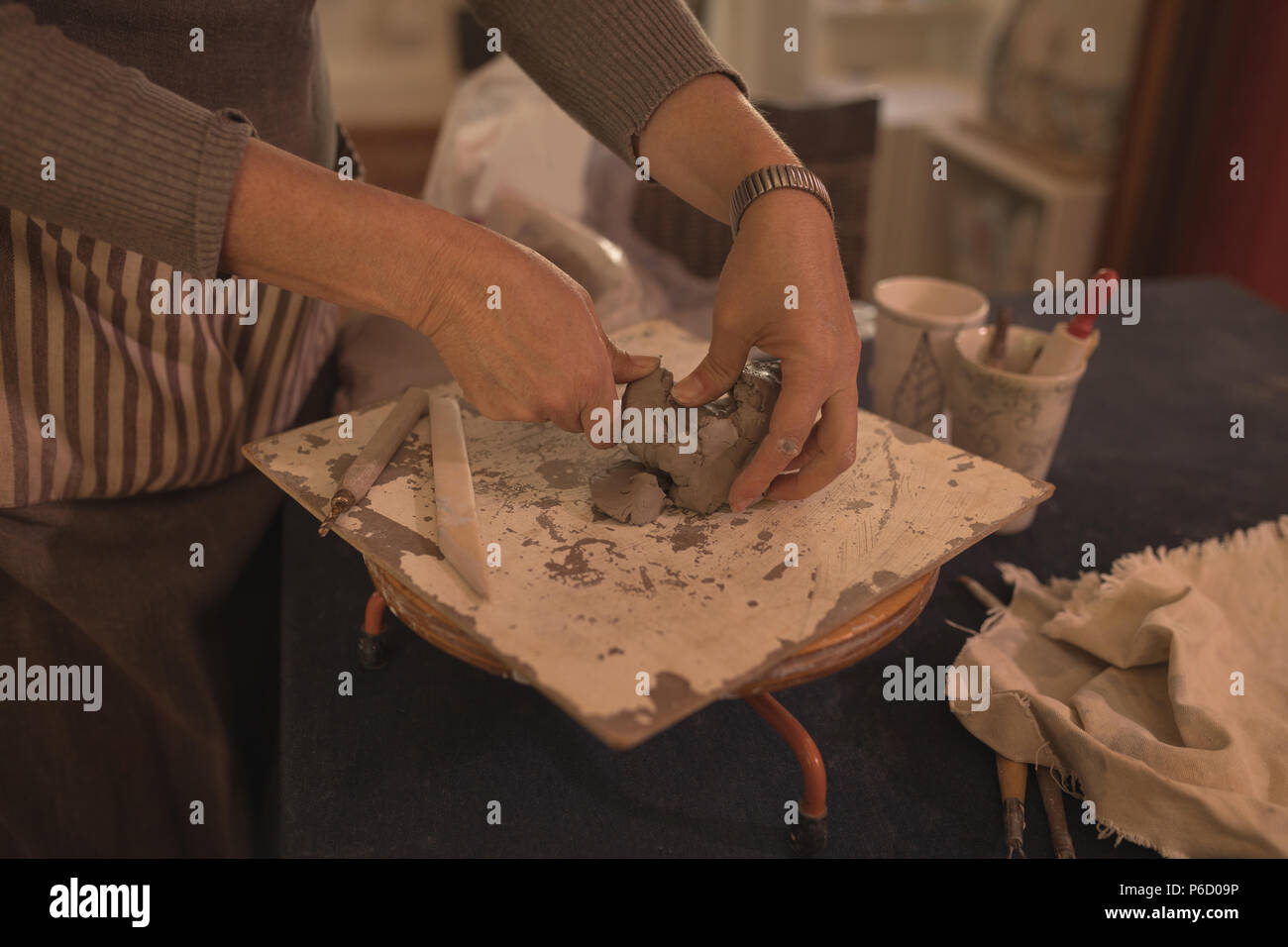 Female potter moulding a clay at home Stock Photo Alamy
