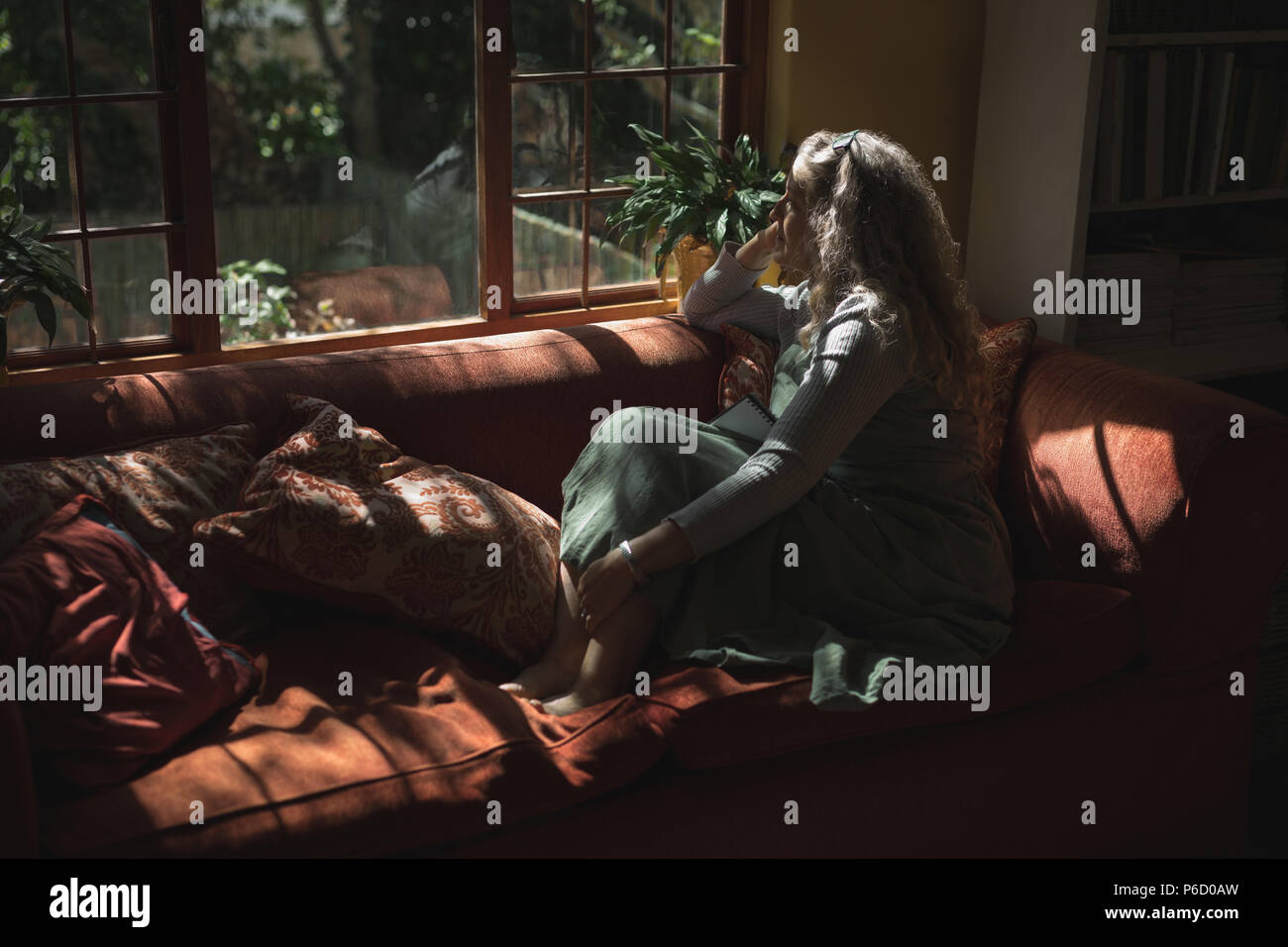 Mature woman on sofa hi-res stock photography and images - Alamy