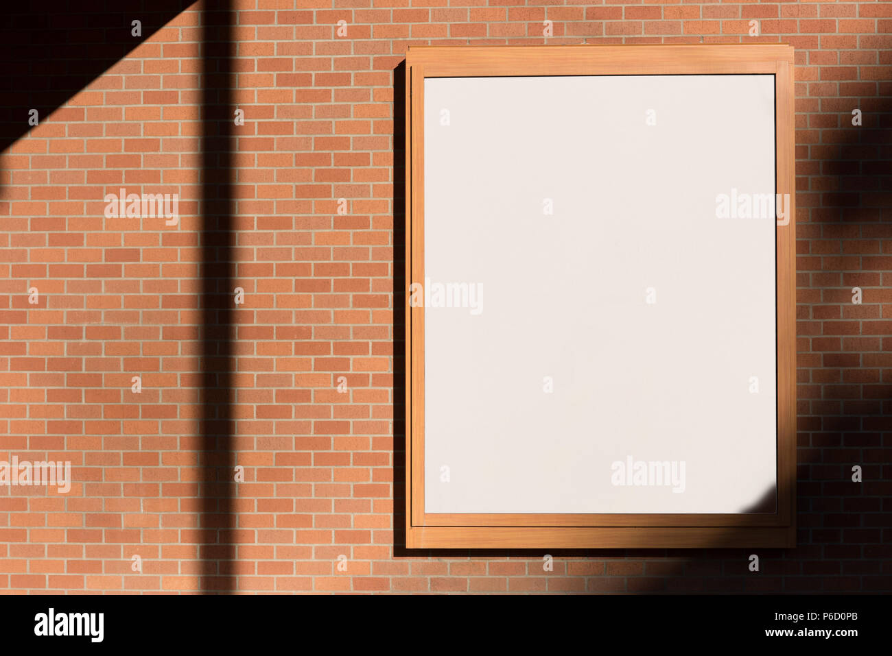 Billboard on brick wall Stock Photo