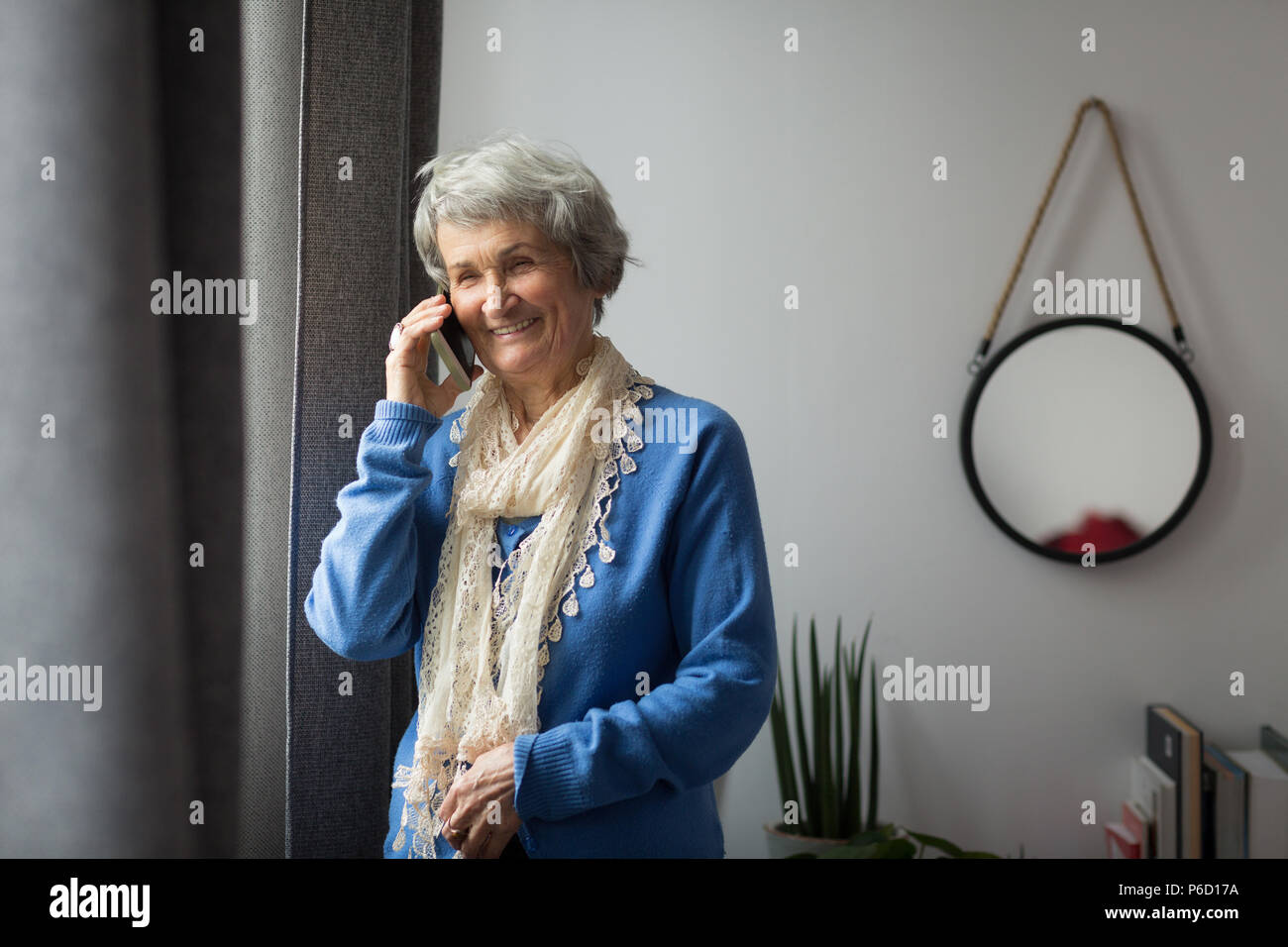Senior woman talking on mobile phone Stock Photo - Alamy