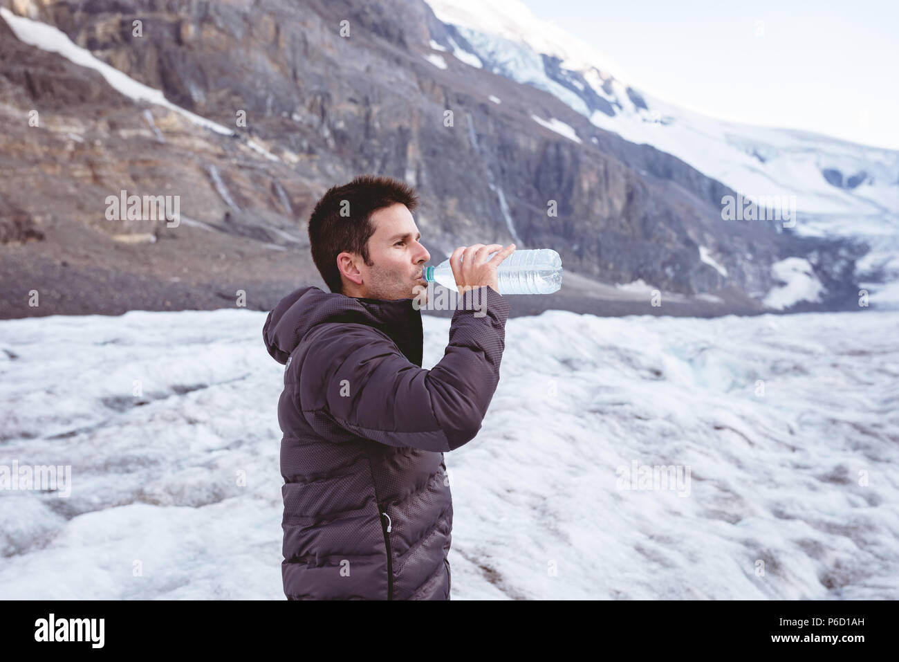 Man drinking water from water bottle Stock Photo