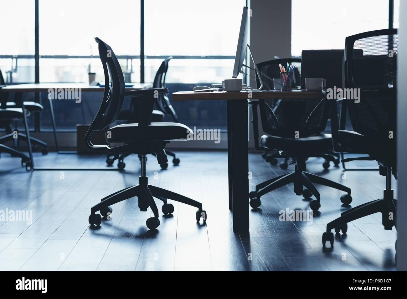 Desk with chairs and table in office Stock Photo
