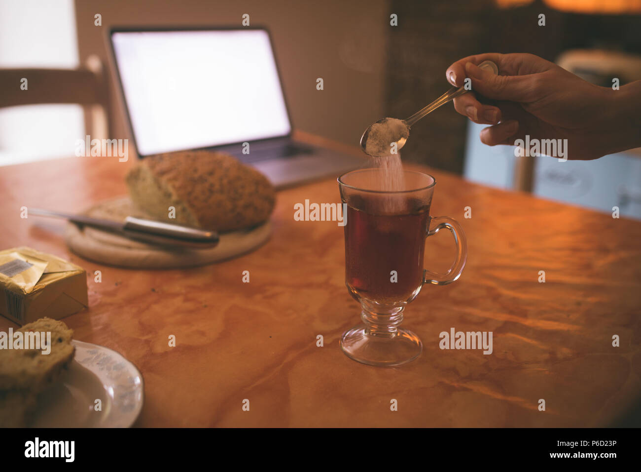 Sugar spoon tea adding hires stock photography and images Alamy