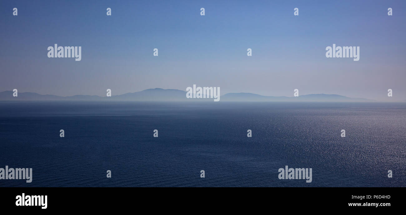 Horizon concept. Blue sky, sea and island background - Greece, Aegean sea, banner Stock Photo